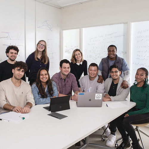 Lauren Gardner with graduate students in a lab